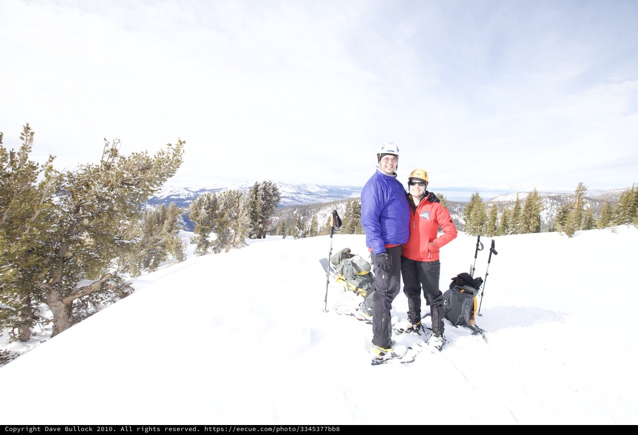Couple Poses at Snowy Lake Tahoe Summit