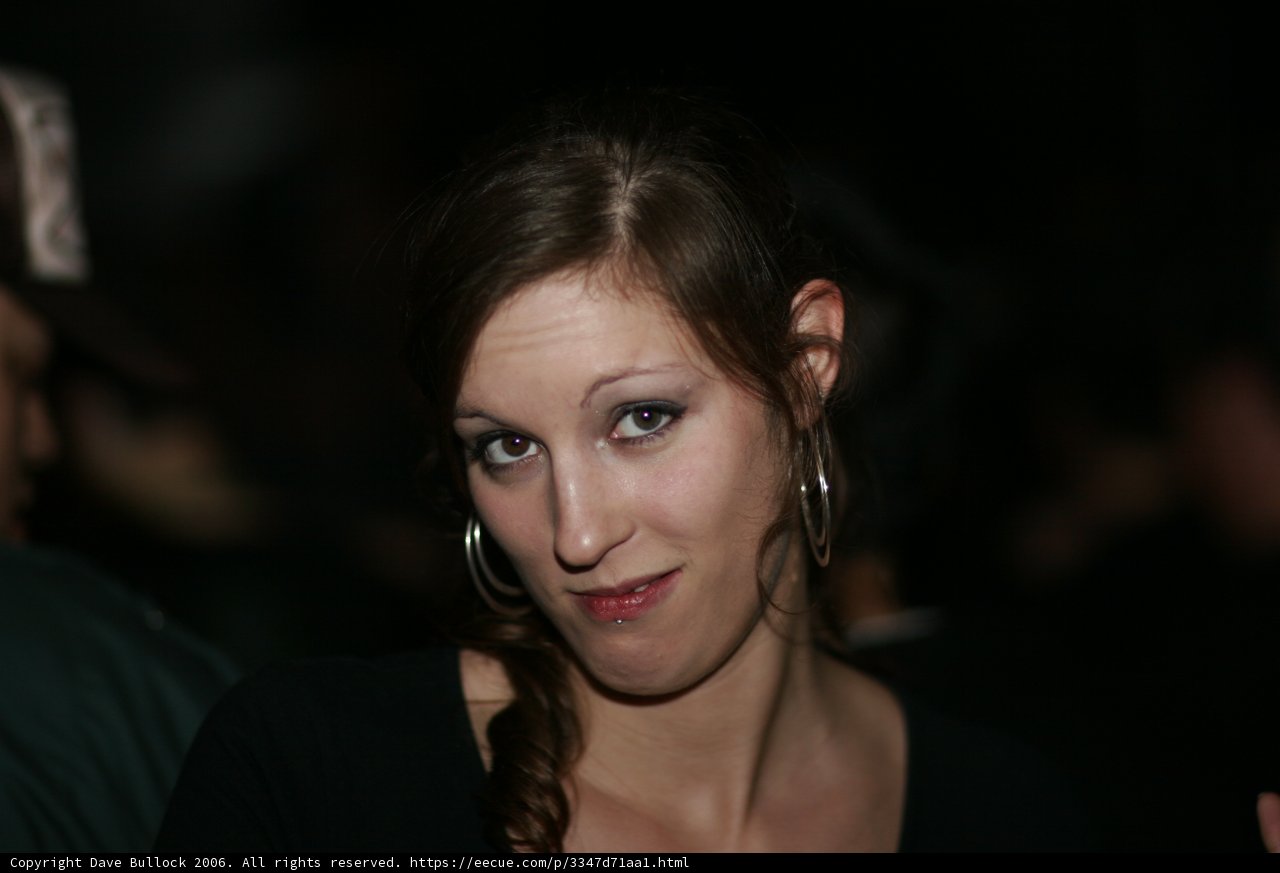 Portrait of a Happy Woman with Black Shirt and Earrings