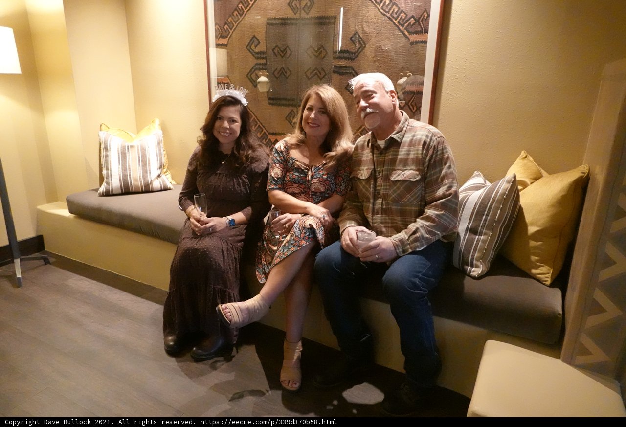 Three Friends Relaxing on a Cozy Sofa