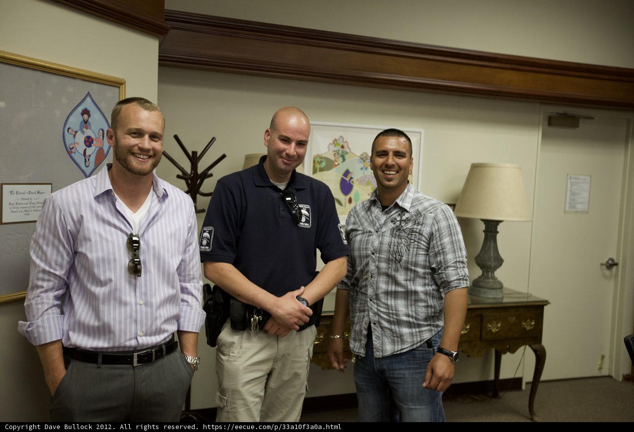 Three Men in an Office Room