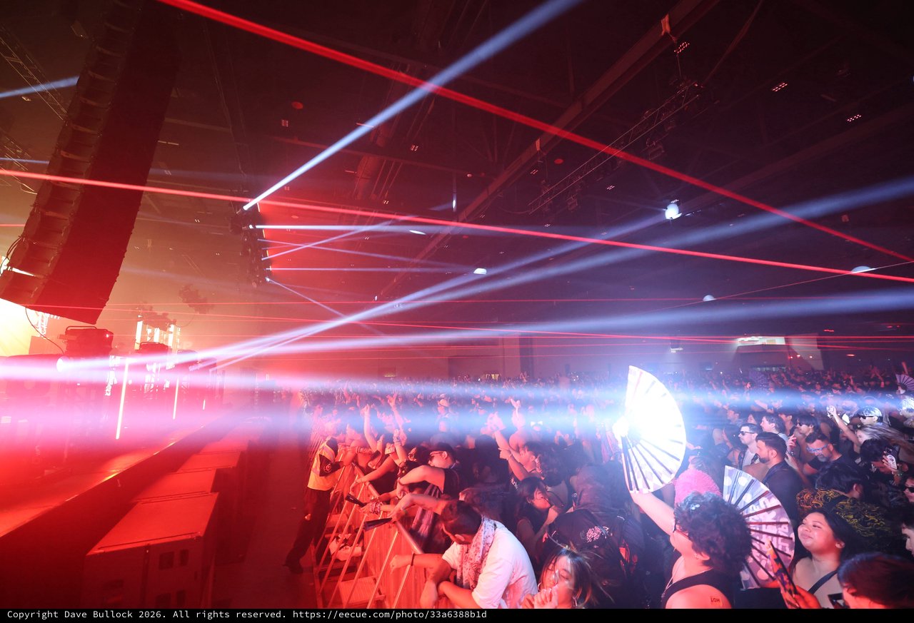 Laser Light Storm Over Pulsing Festival Crowd