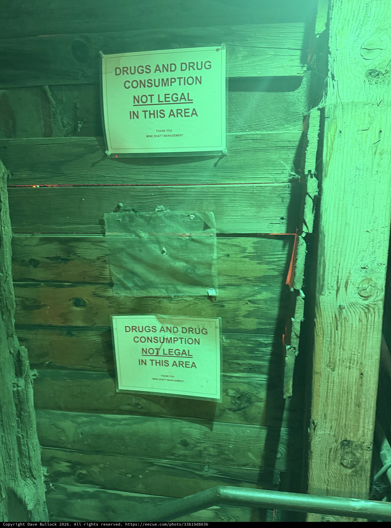 Drug Warning Signs in Green-Lit Mine Alley