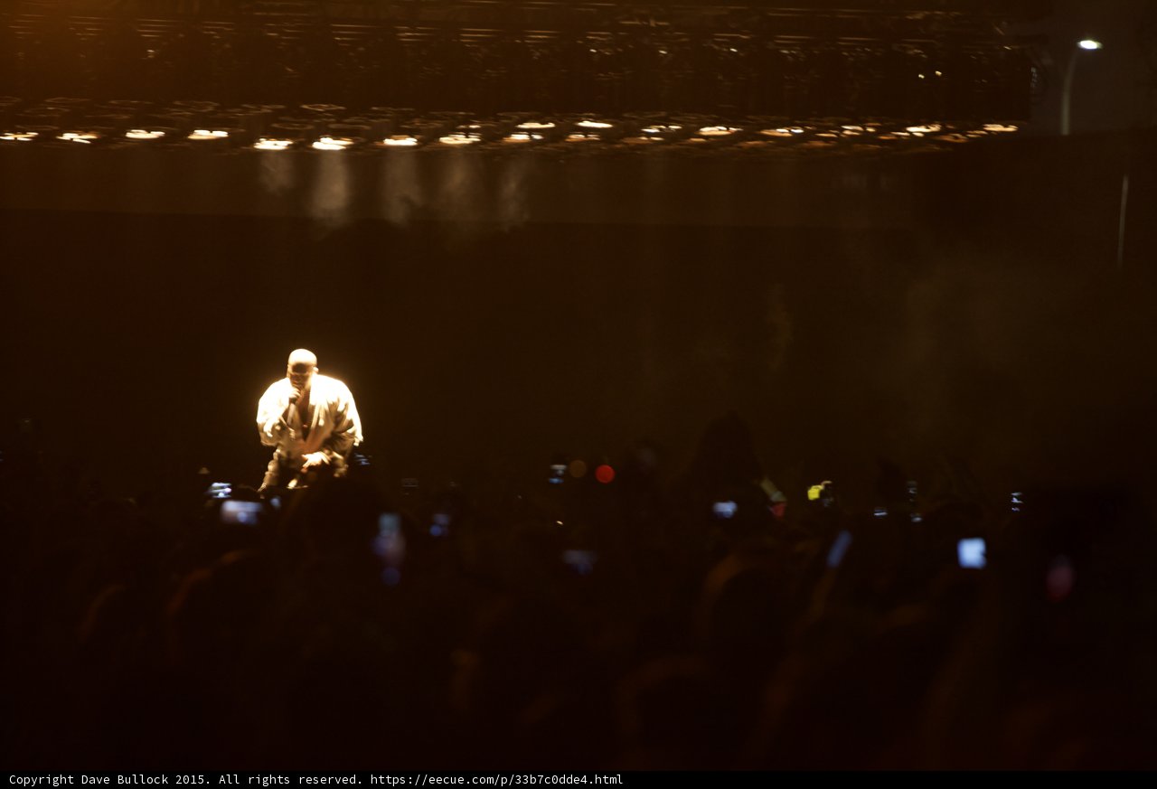 Kanye West Kneeling on Stage