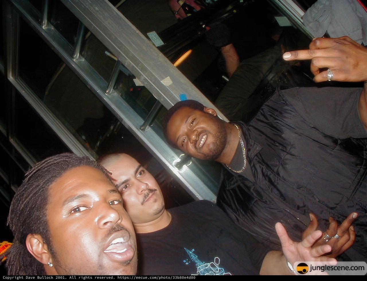 Three Men Strike a Pose at the Koncrete Jungle Party