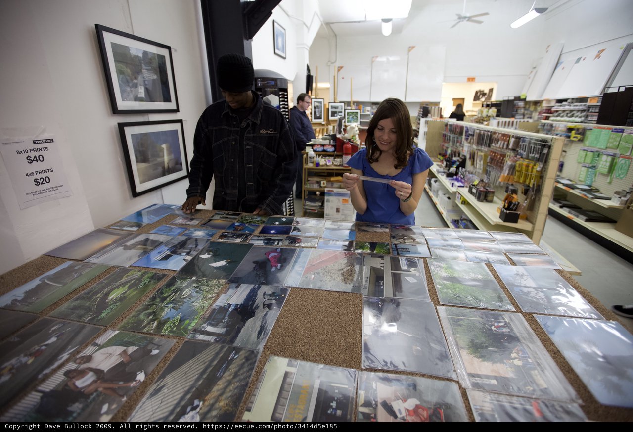 Photography Enthusiasts Browse Prints at Art Walk