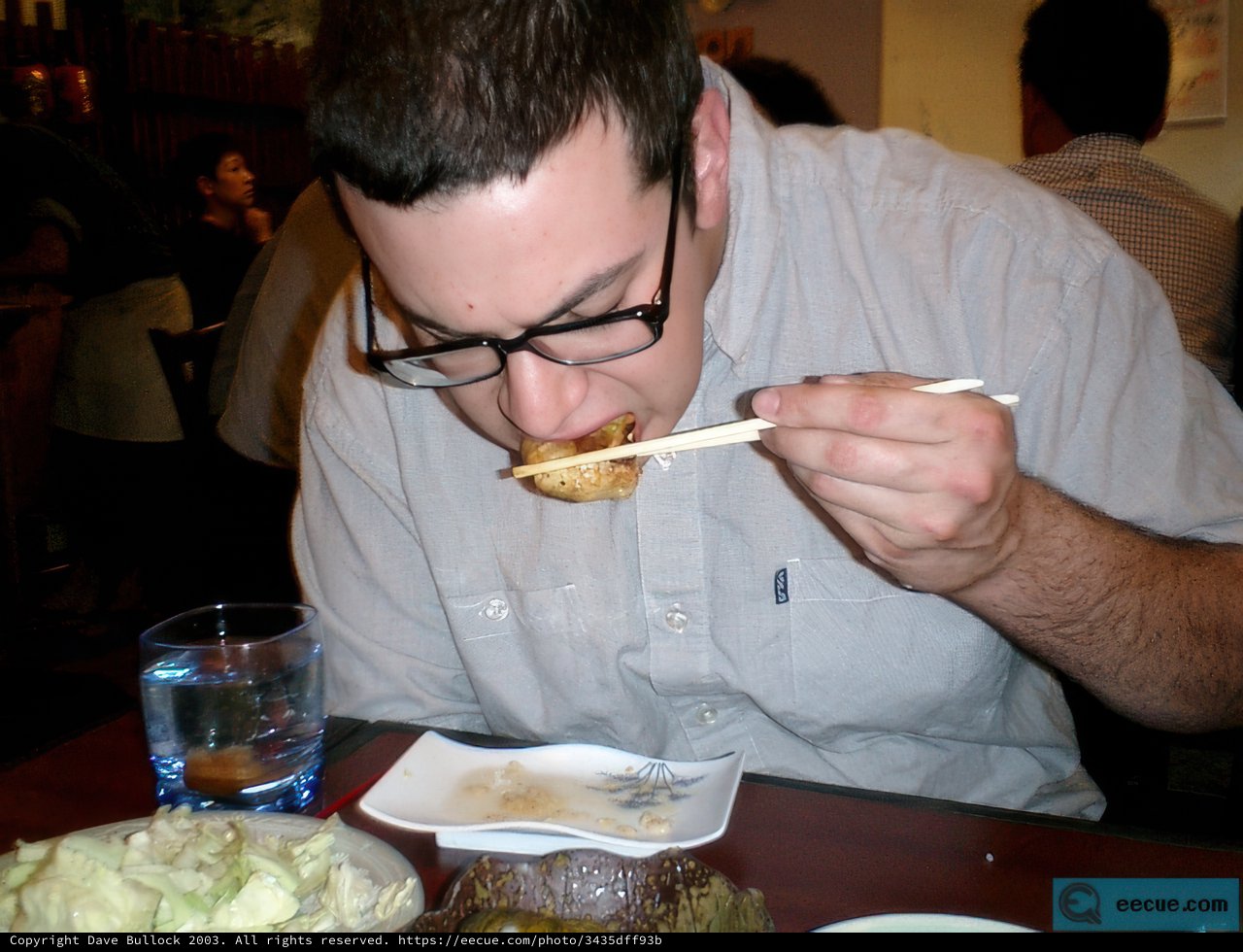 Man Eating at Restaurant