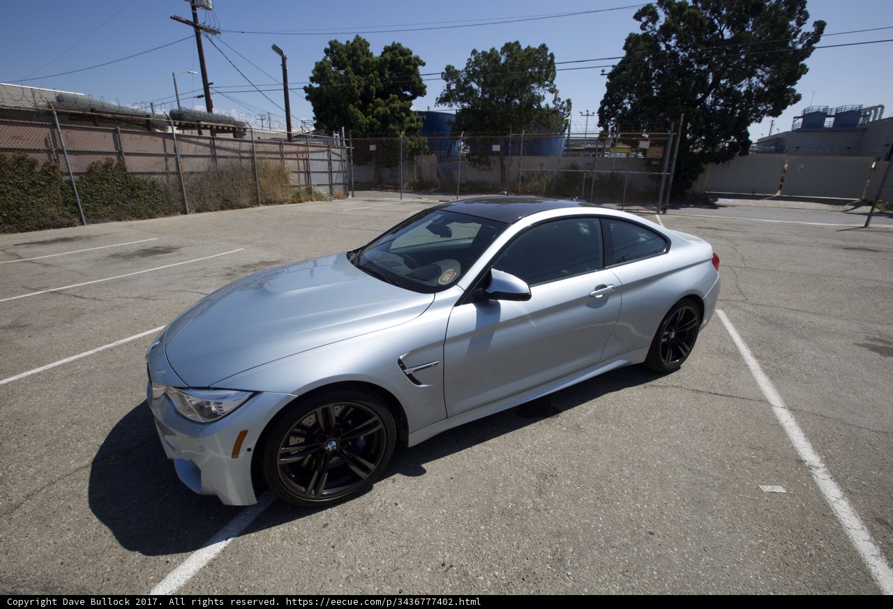 Parked BMW M4 Coupe Shines under Blue Skies