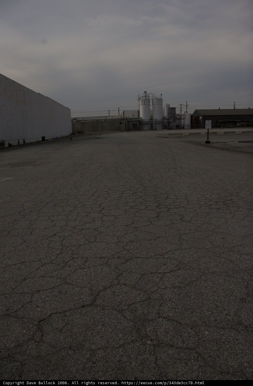 Desolate Lot with Factory in the Distance