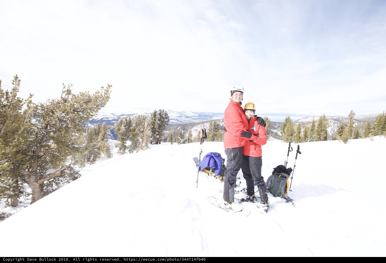 Couple Embracing at Snowy Lake Tahoe Summit
