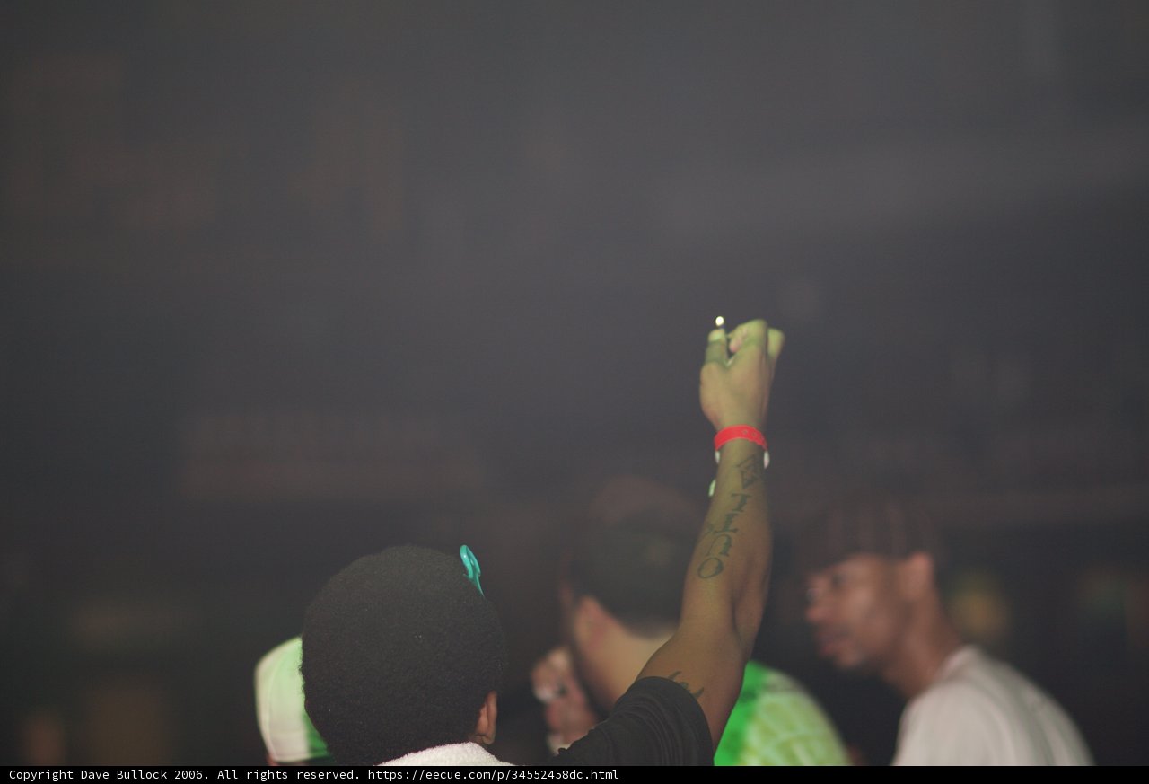 Tattooed Man in a Party Crowd