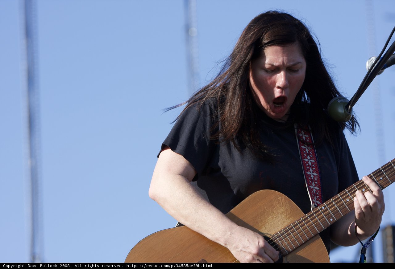 Kim Deal strums her guitar at Coachella 2008