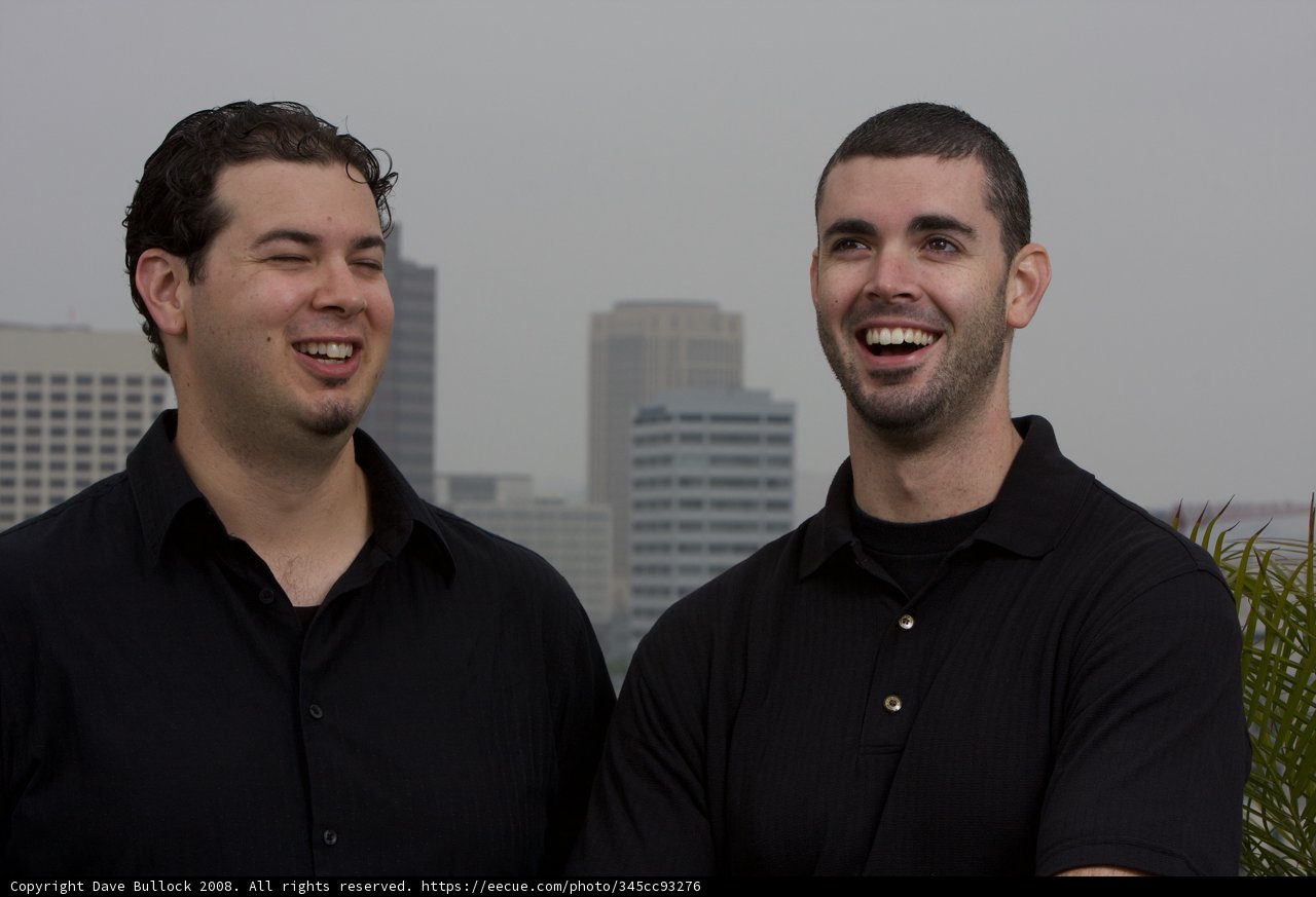 Two Happy Men in Black Shirts