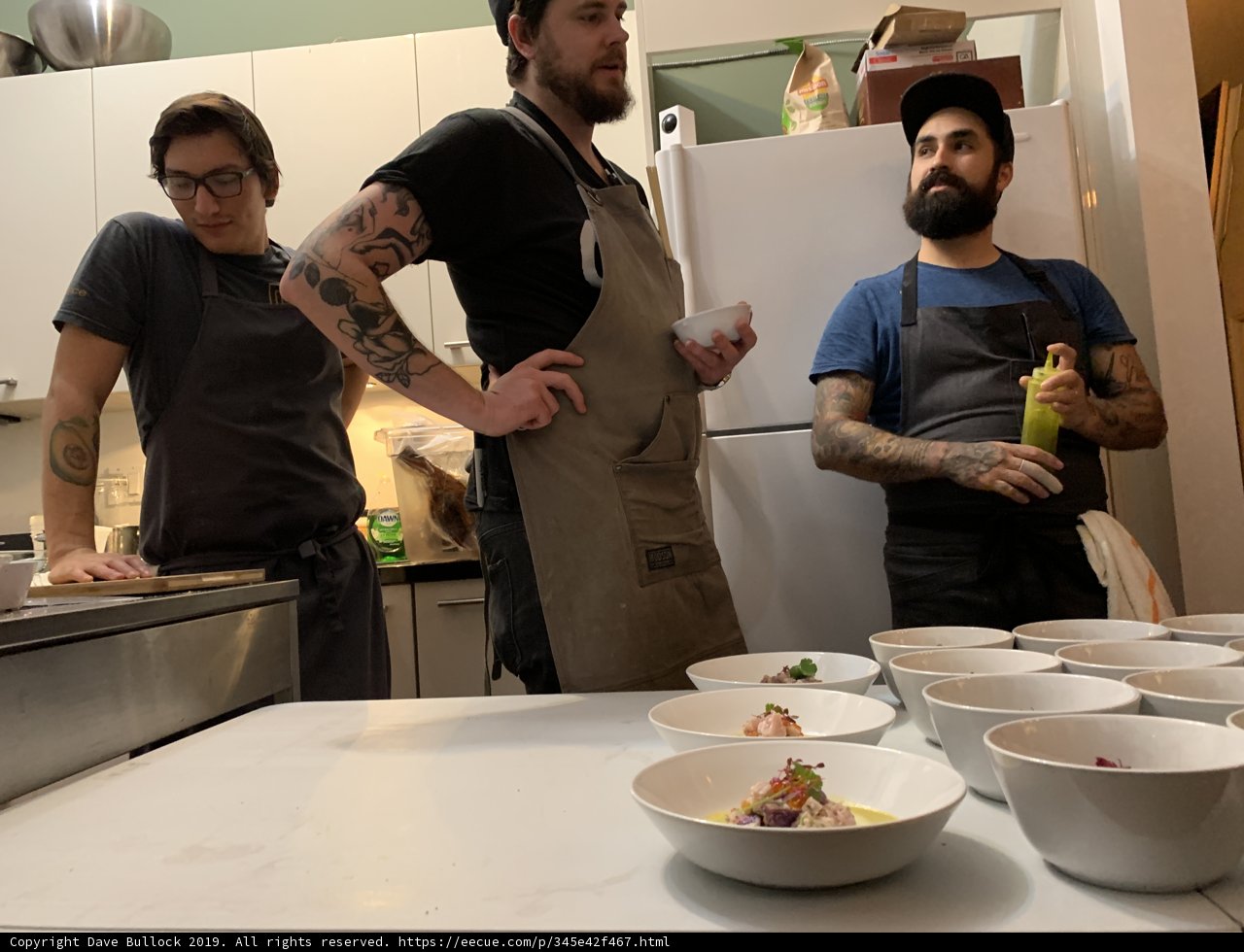 Three Men Enjoying a Meal Together