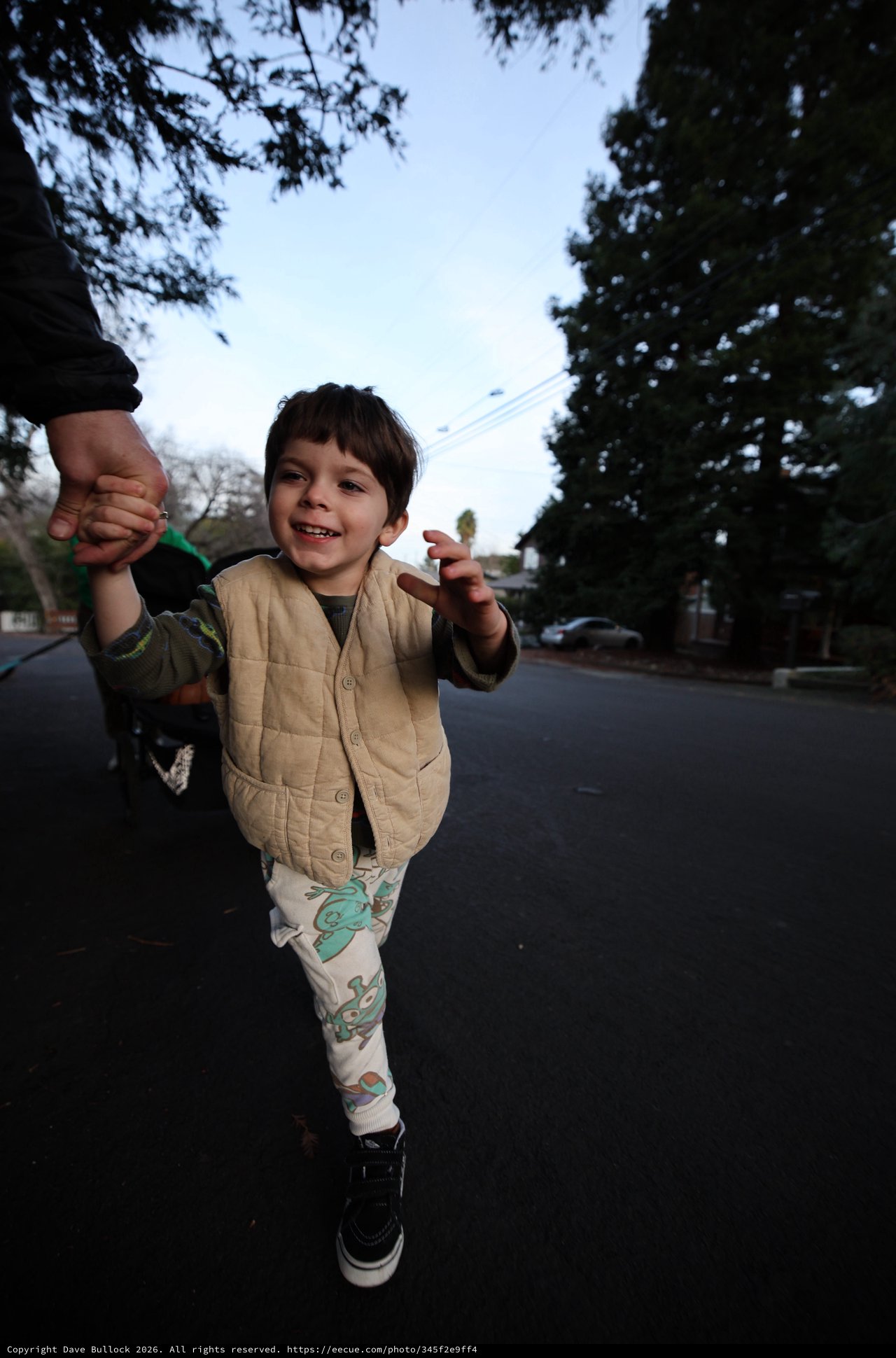 Joyful Child on Evening Walk with Parent