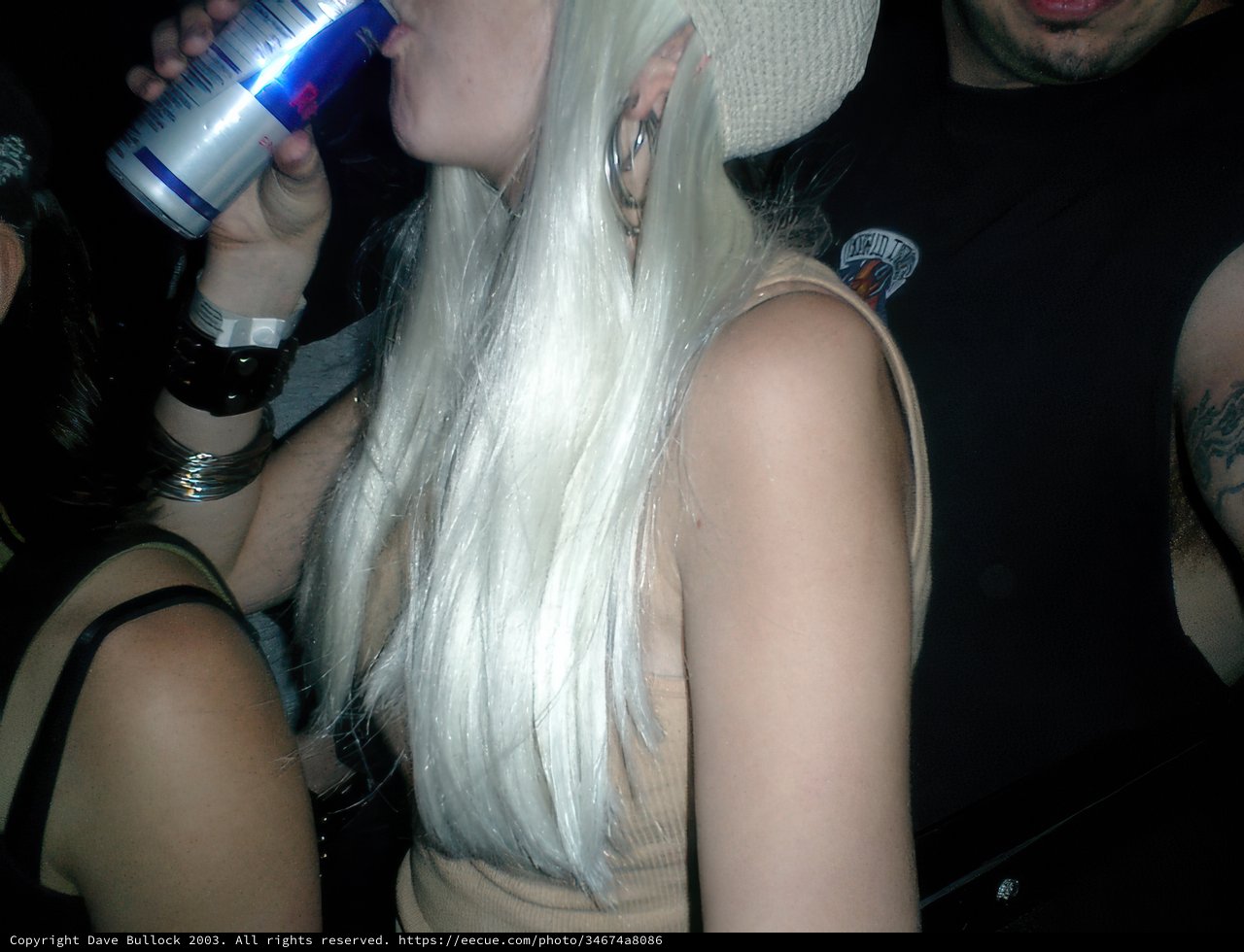 White-haired Woman with a Drink in Her Hand