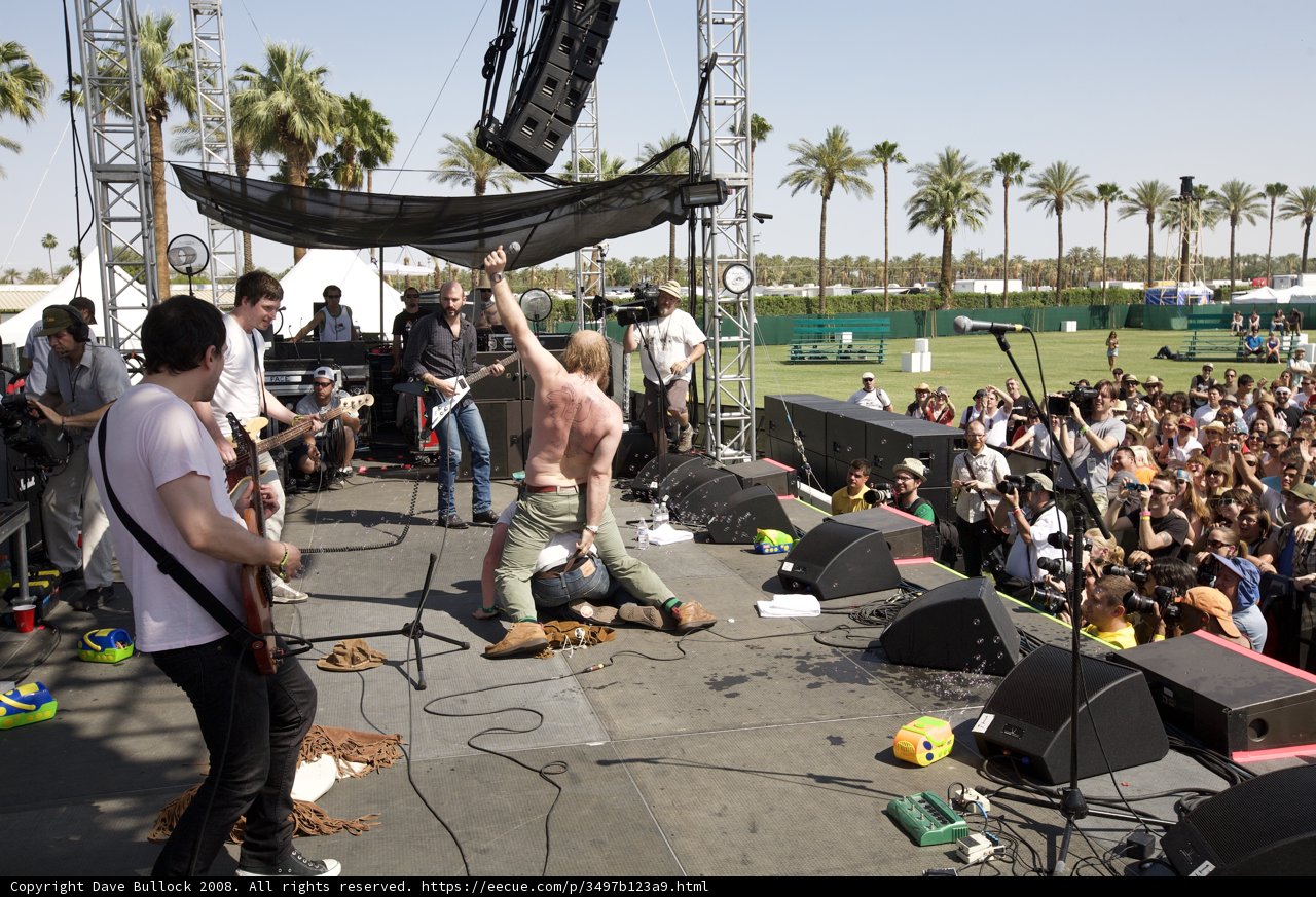 Entertainer rocking the stage under the palm trees