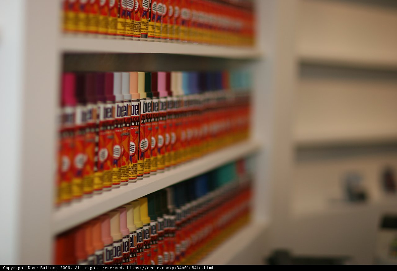 Colorful Tubes of Paint on a Shelf