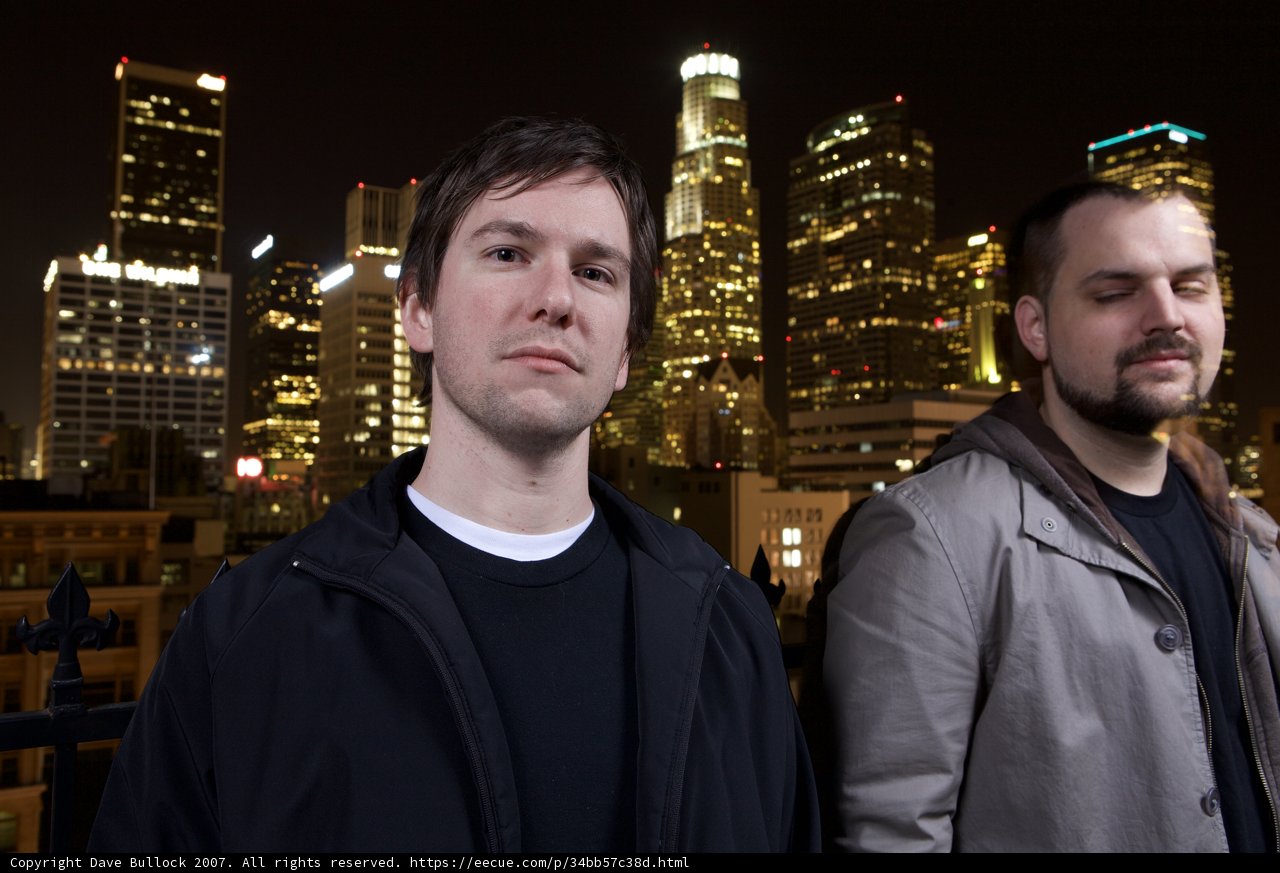Two Men Against the Metropolis Skyline