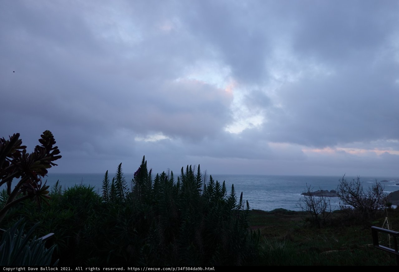 Hillside View of Ocean and Clouds