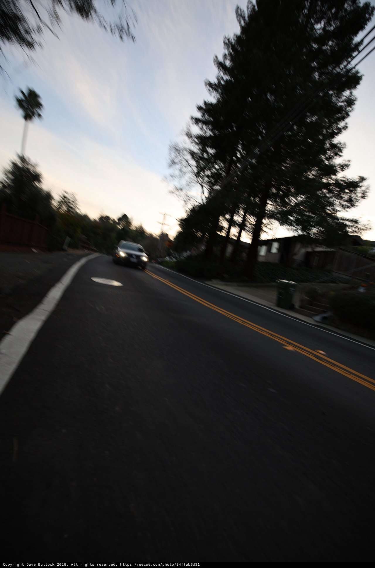 Blurred Evening Road Through Residential Neighborhood