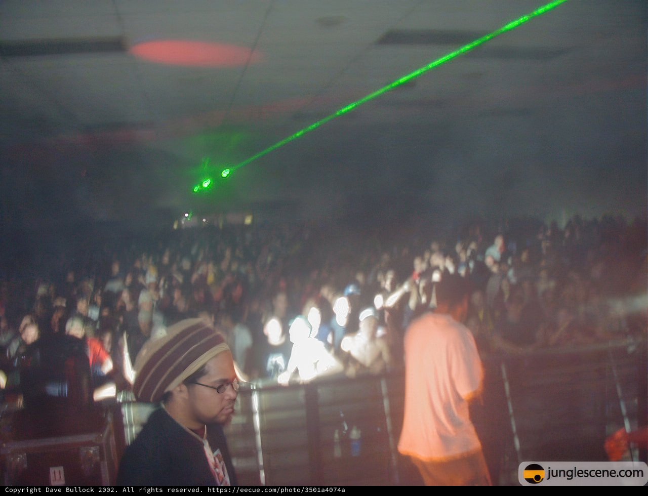 Green Laser Lights Illuminate the Crowded Nightclub