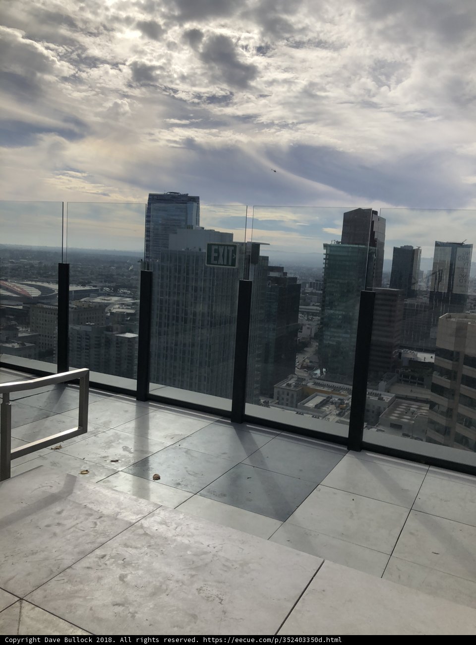 Cityscape View from Rooftop Bench