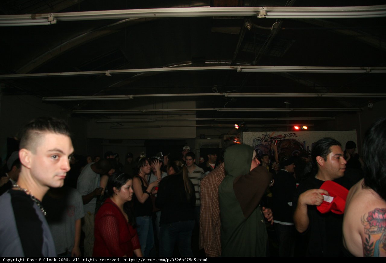 Tattooed Man in a Crowded Urban Pub