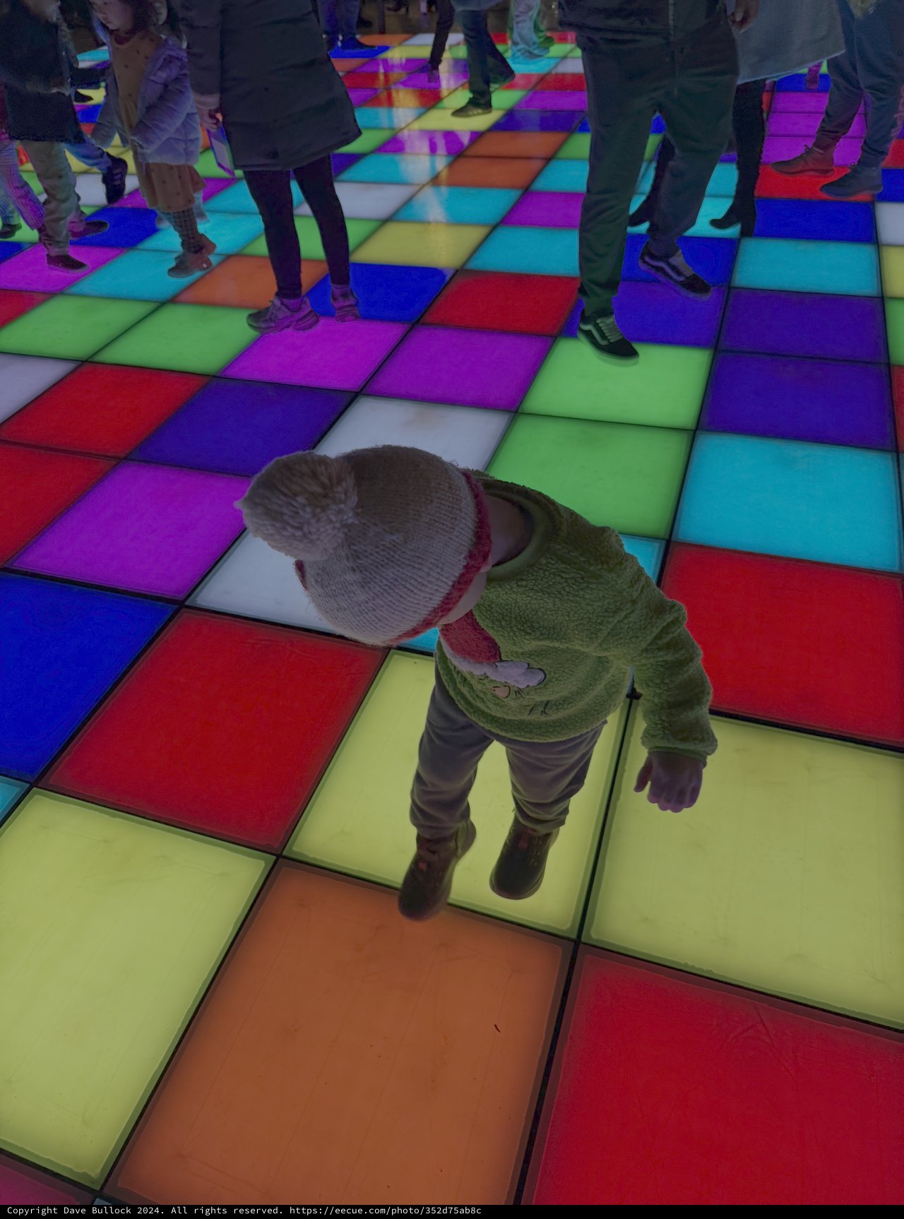 Toddler Explores Colorful Interactive Light Floor
