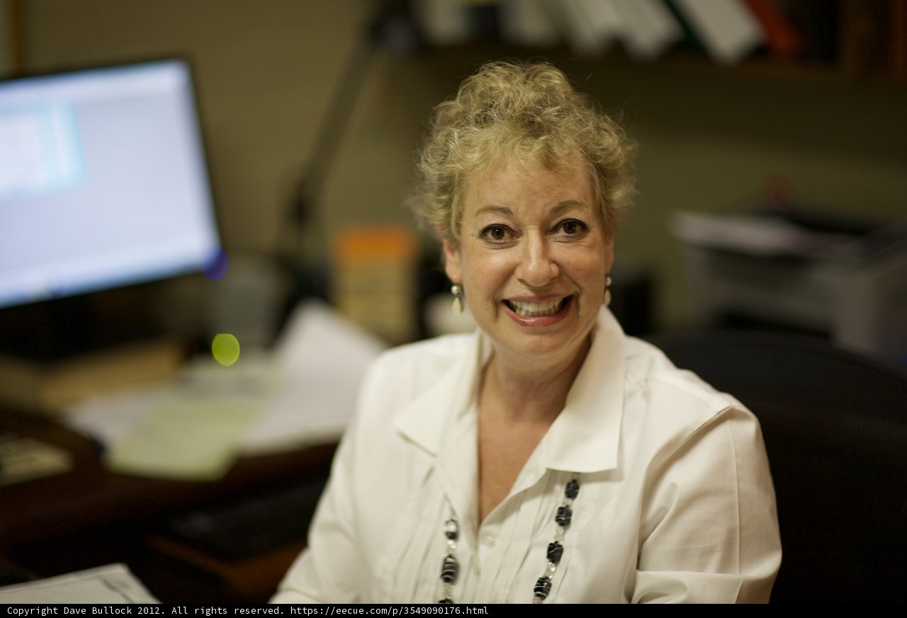 Smiling Woman at Desk