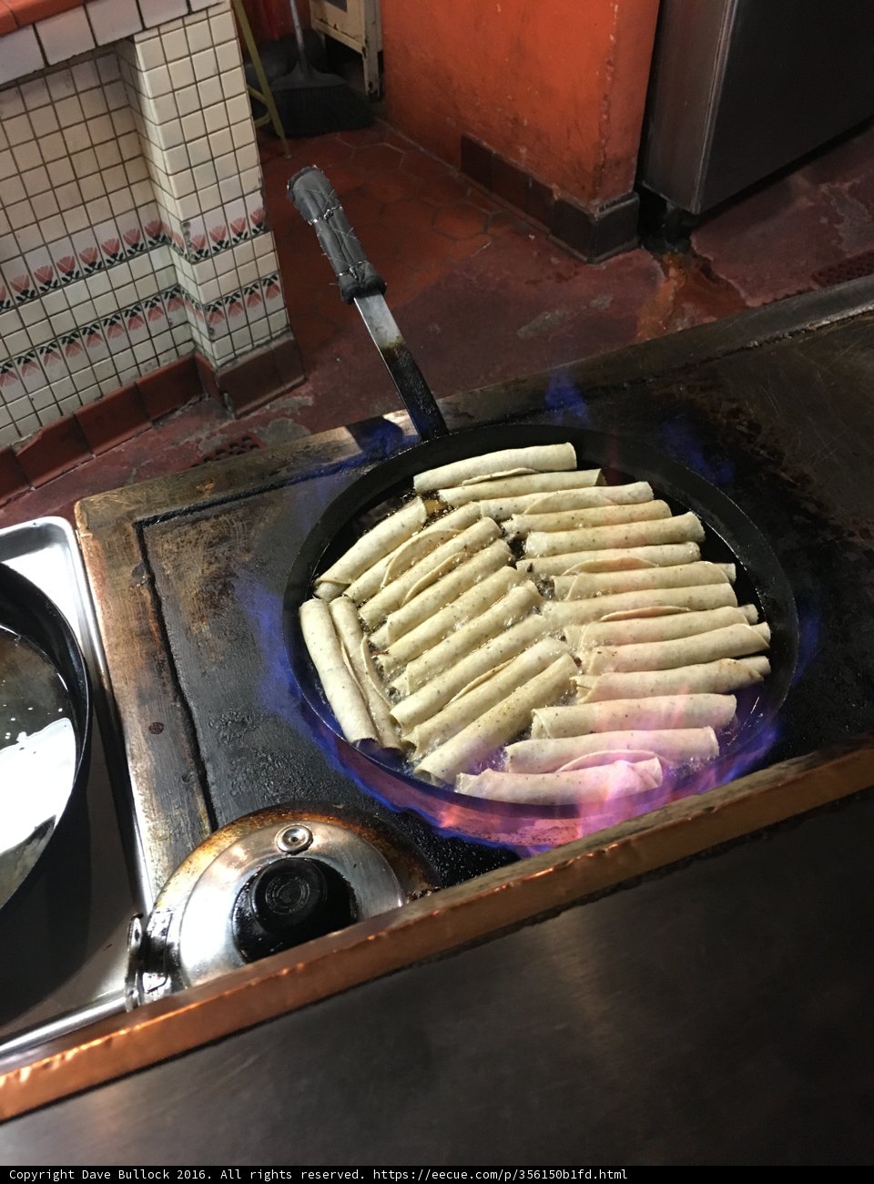 Hot Dogs on a sizzling Cooking Pan