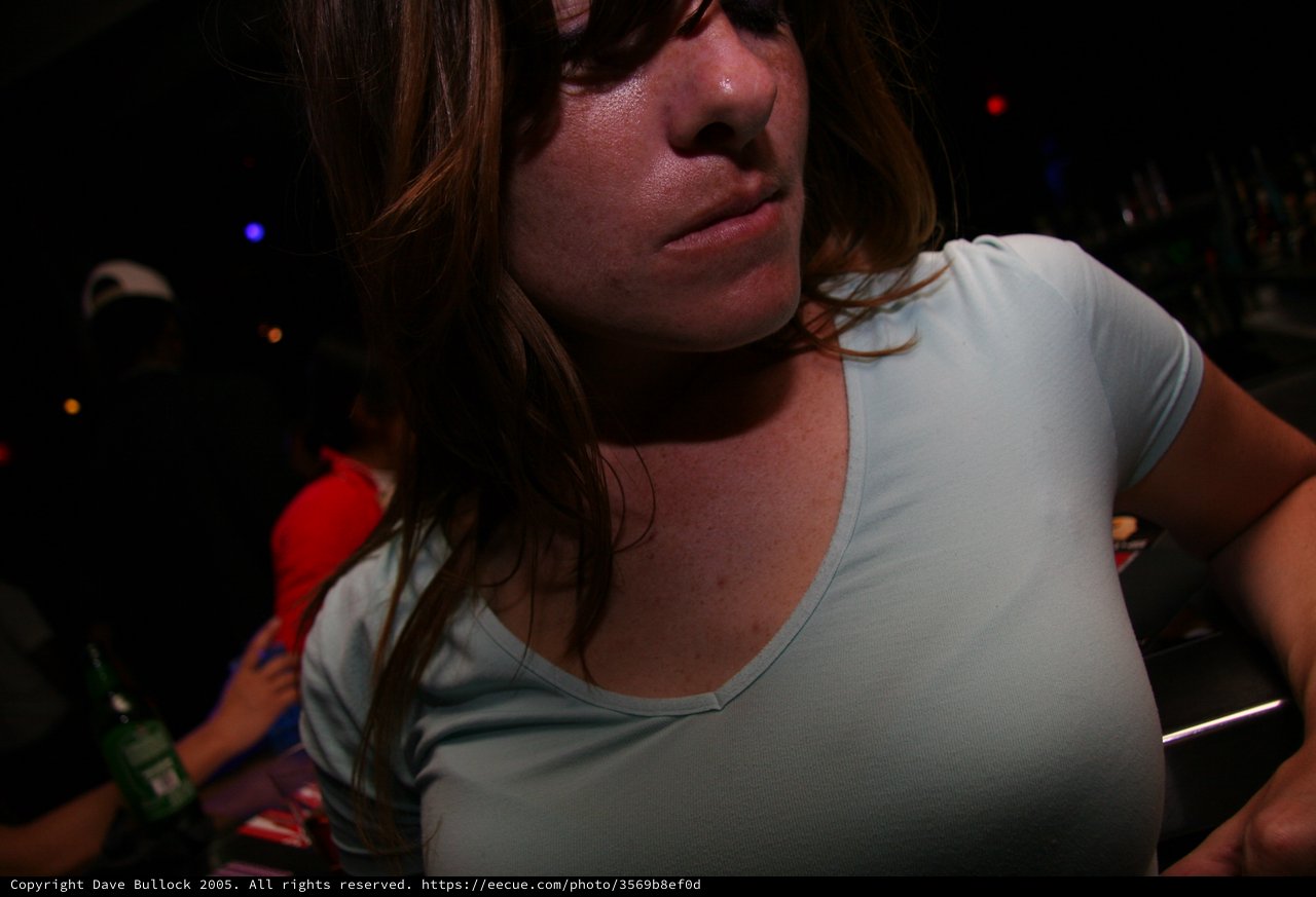 Woman at Nightclub in Dramatic Ambient Light