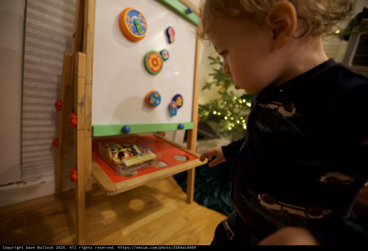 Young Child Playing with Educational Toy on Christmas