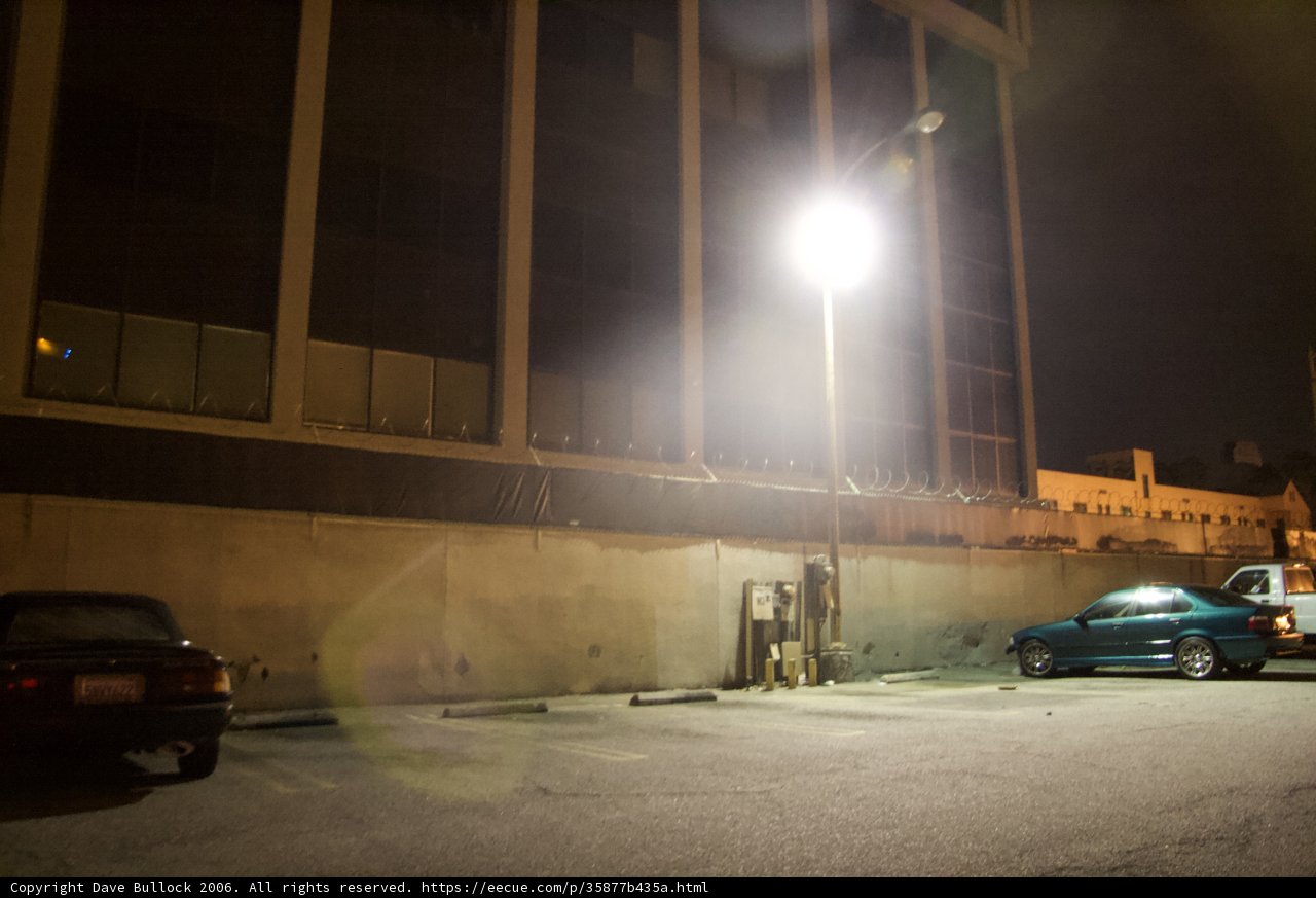 Nighttime Coupe Parked in Front of Office Building