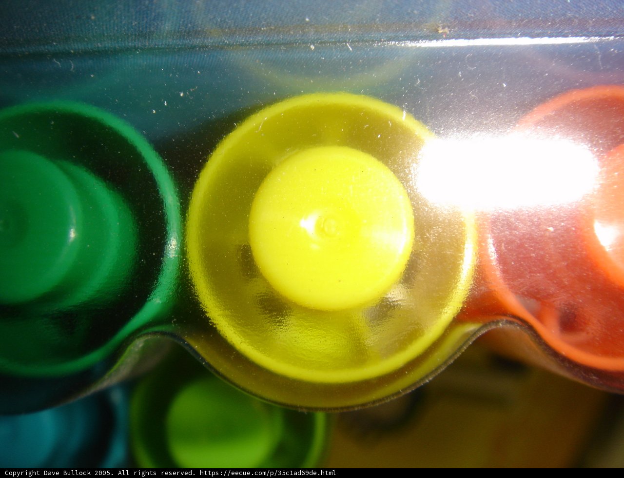 Colorful Buttons in Plastic Container