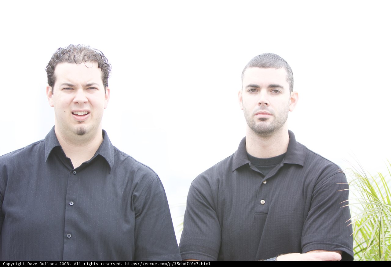 Two Men in Black Shirts