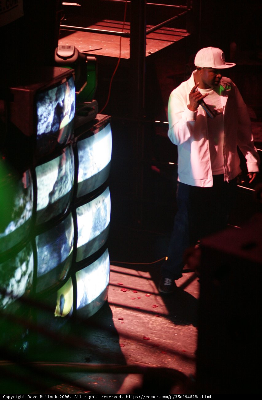 Alexei Bell performing on stage with a monitor