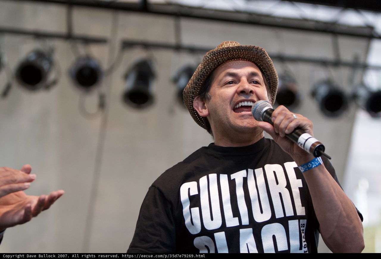 The Hype Man with a Hat and a Mic