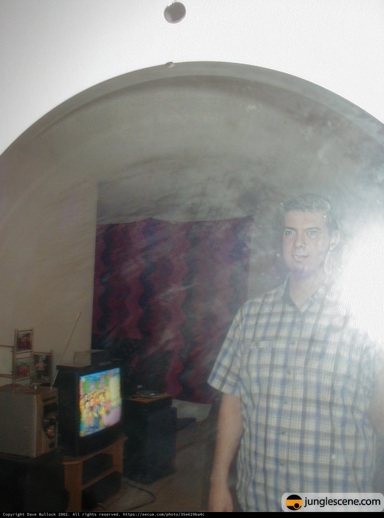 Reflection of a Man in an Urban Room
