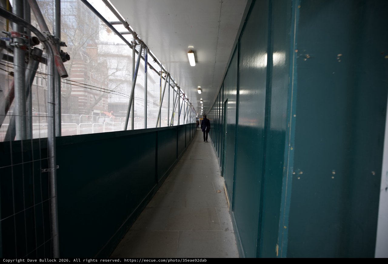 Solitary Figure in Urban Pedestrian Tunnel