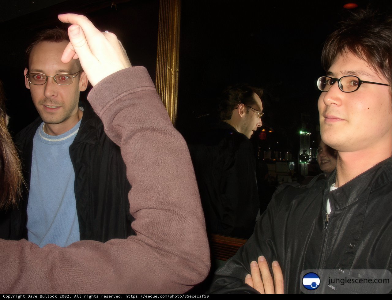 Man in Black Jacket at Pub