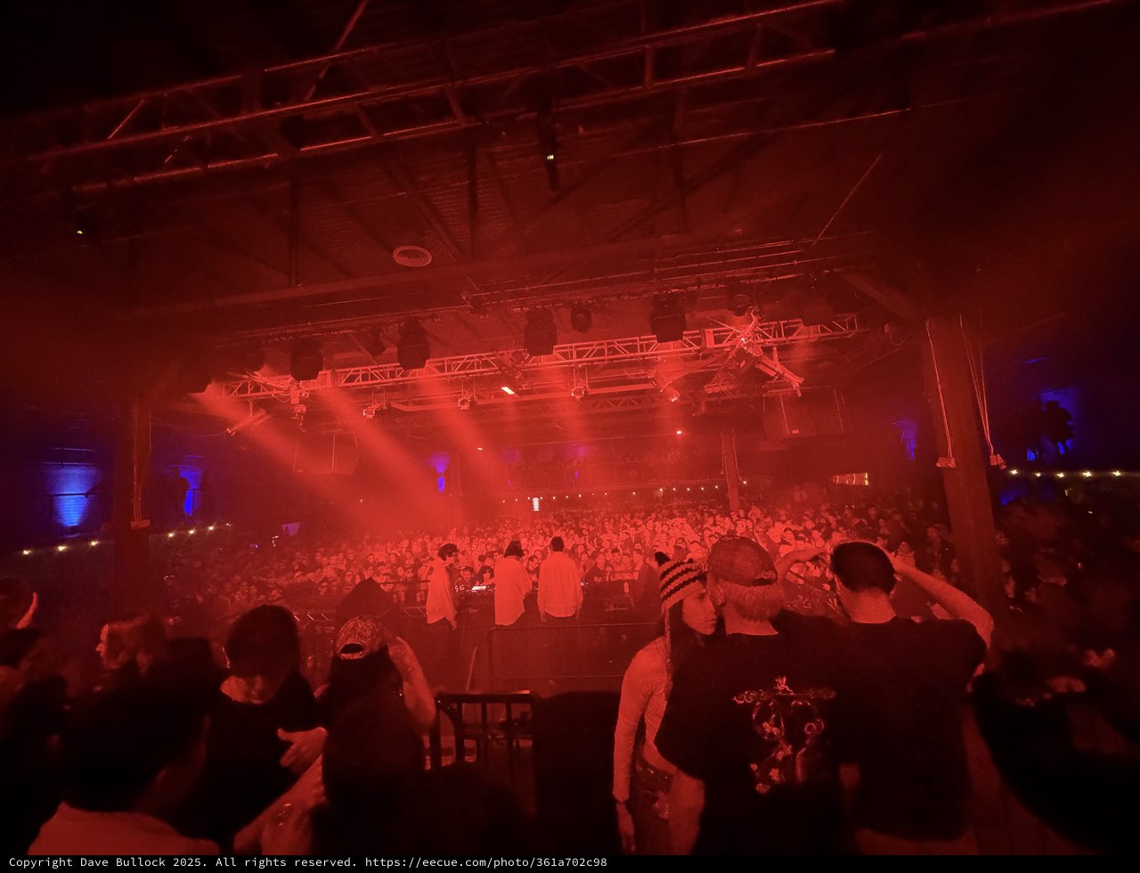 Red Light Illuminates Massive Electronic Music Concert Crowd