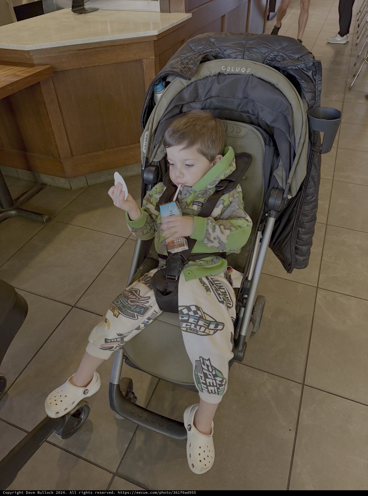 Young Child Relaxing in Stroller Indoors