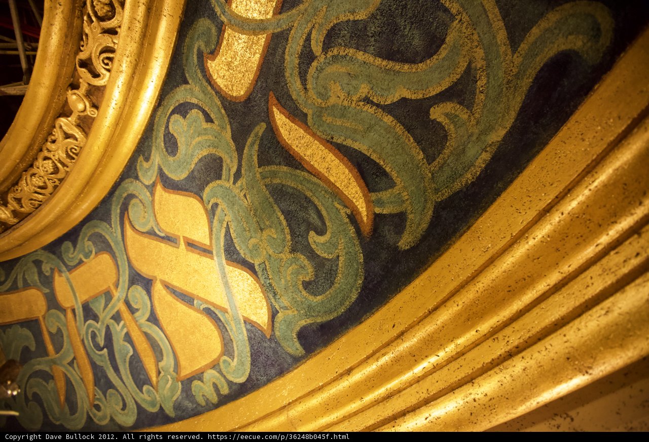 Ornate Gold and Blue Artwork Adorns Church Wall