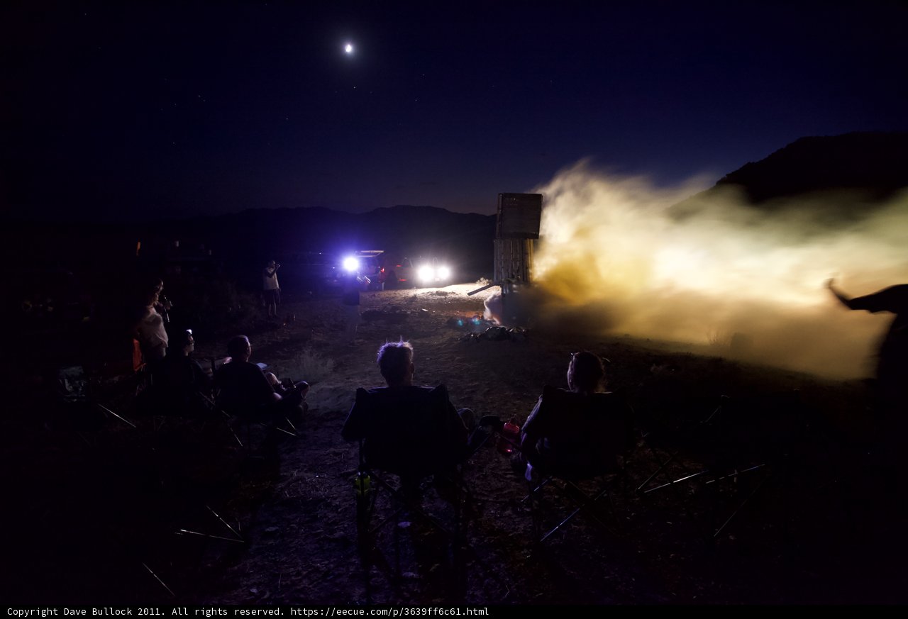 Flames Light Up the Night Sky as People Watch Rocket Launch