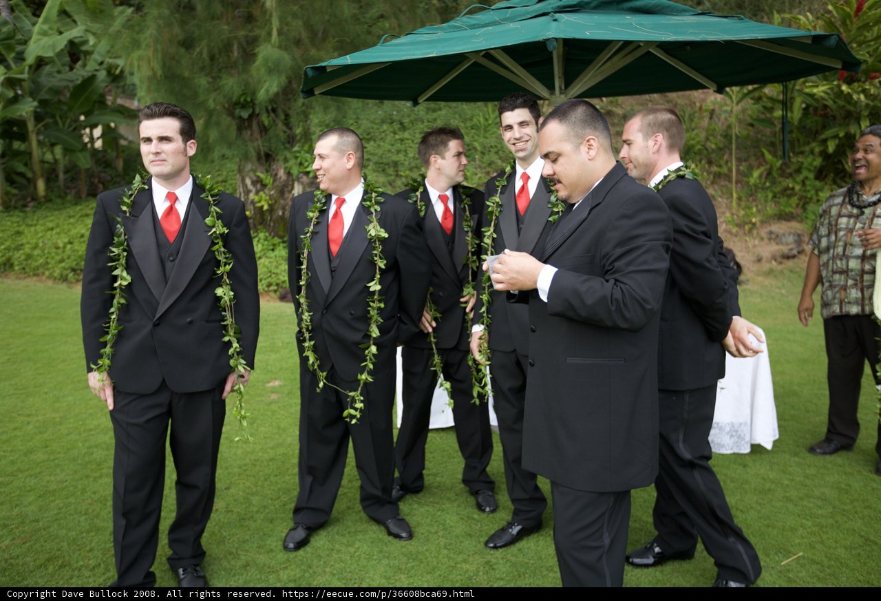 Groomsmen taking shelter