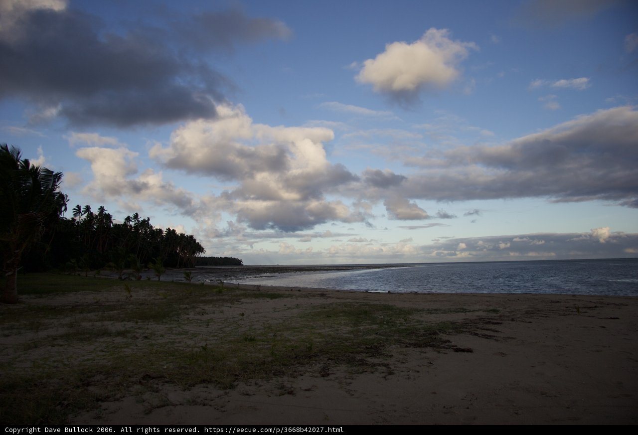 Serene Beach with Majestic Clouds