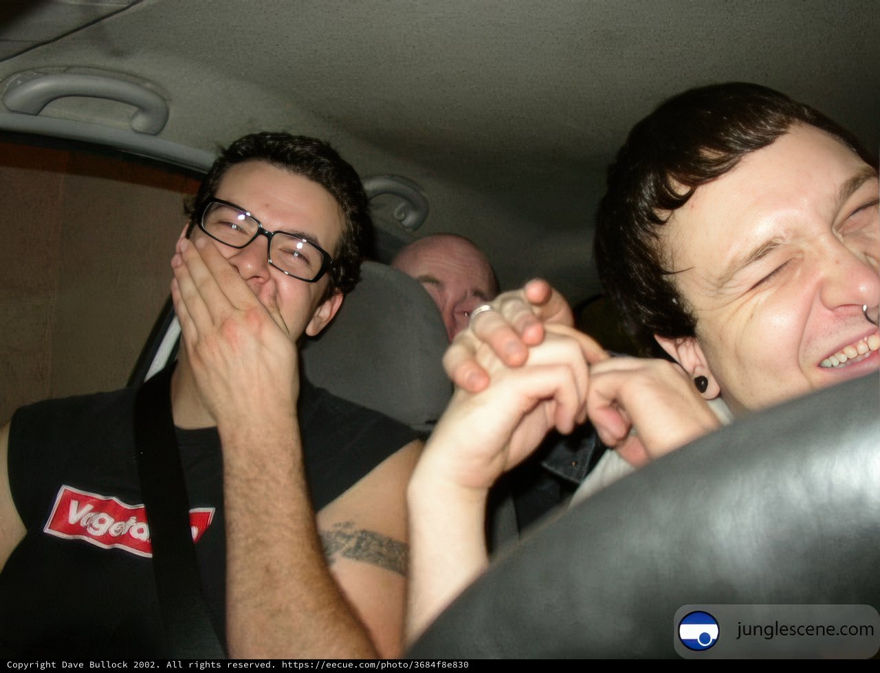 Two Men in the Back Seat