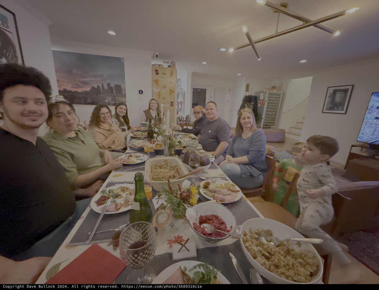 Family Thanksgiving Dinner Gathering Around Table