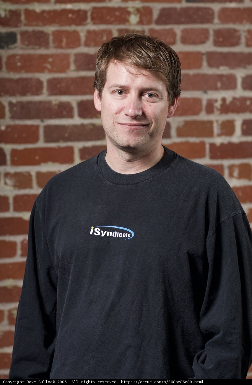 Portrait of a Happy Man in a Brick Wall Setting