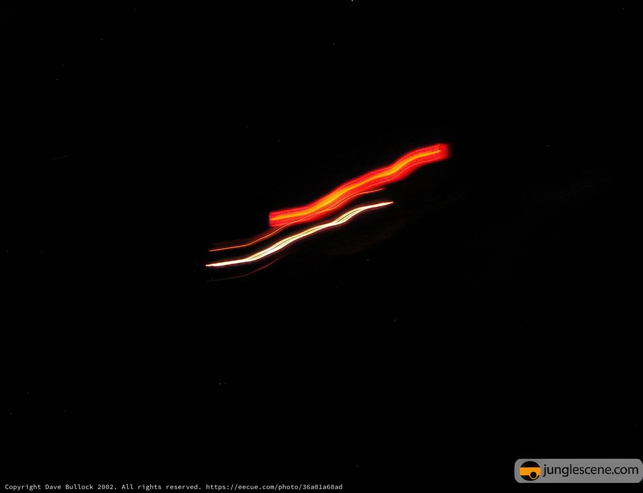 Nighttime Drive with a Red Glow